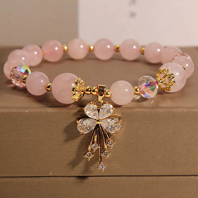 Unisex crystal bead bracelet in aquamarine butterfly colour on neutral background
