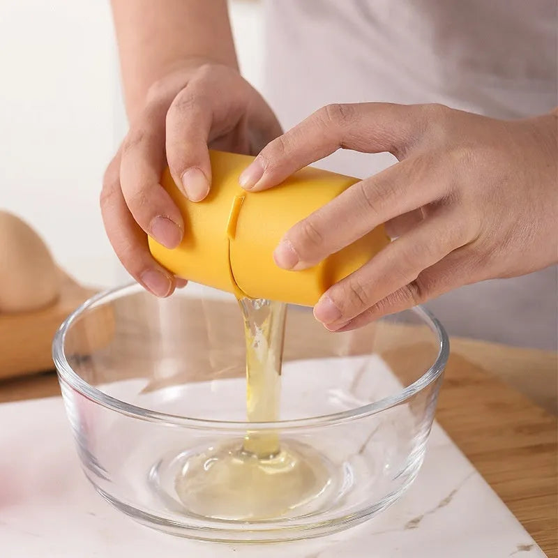 Stainless steel egg shell opener in orange red with PP plastic handle on a kitchen counter