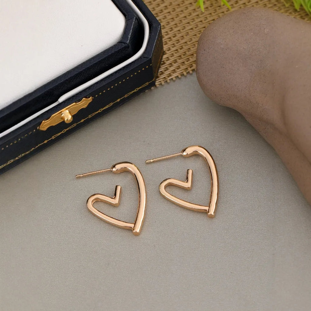 Gold-tone metal simple cold style love dangle earrings for women in golden colour