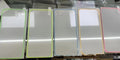 Fluorescent tempered glass screen protector for iPhone showing pink yellow green blue grass green colour options
