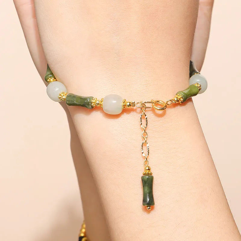 Handmade crystal agate bracelet with cute fruit and bow shapes on a white background