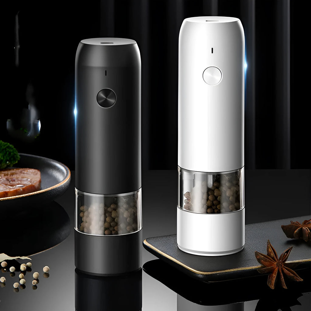 Rechargeable electric pepper and salt grinder set with clear acrylic body, LED light, and USB cable on a countertop