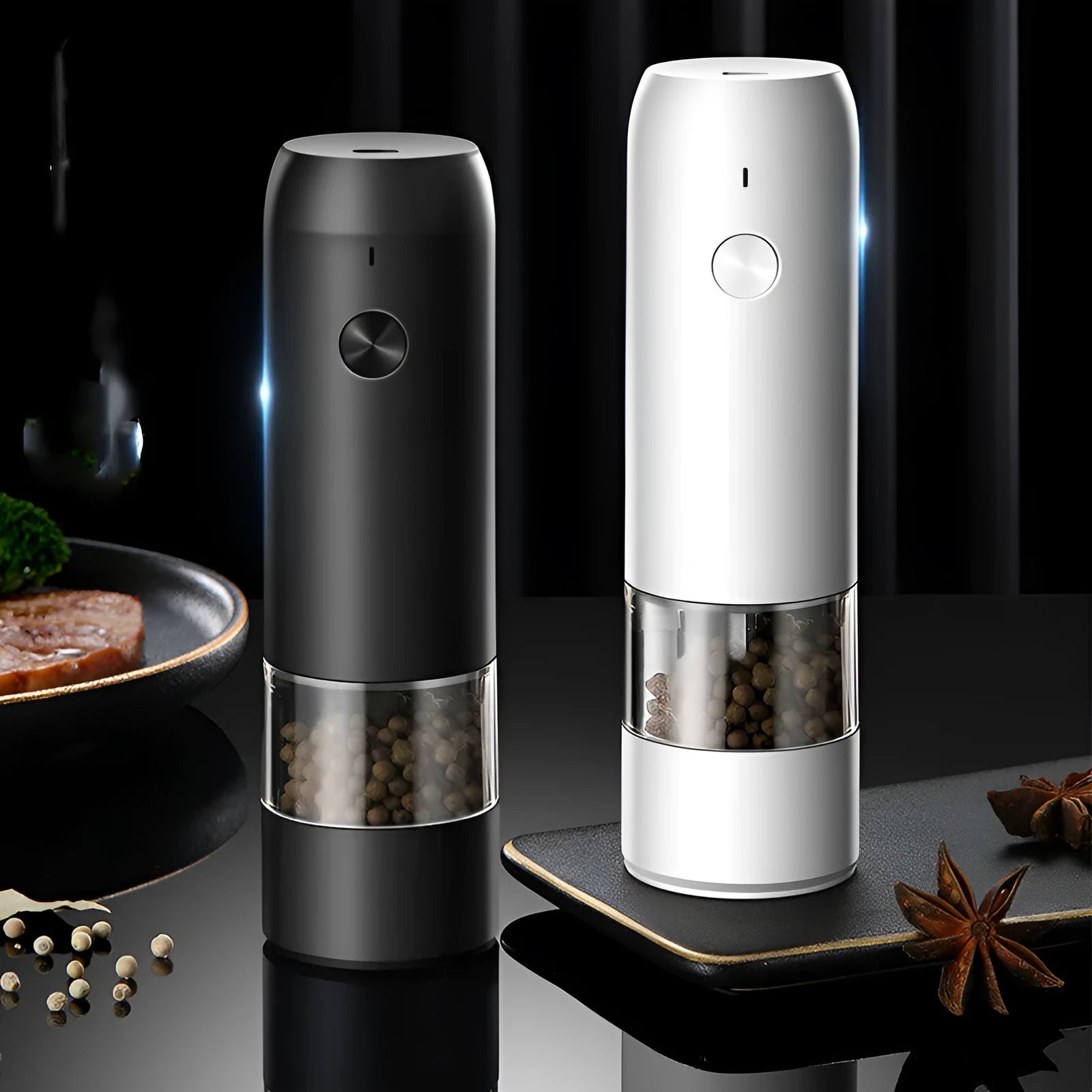 Rechargeable electric pepper and salt grinder set with clear acrylic body, LED light, and USB cable on a countertop