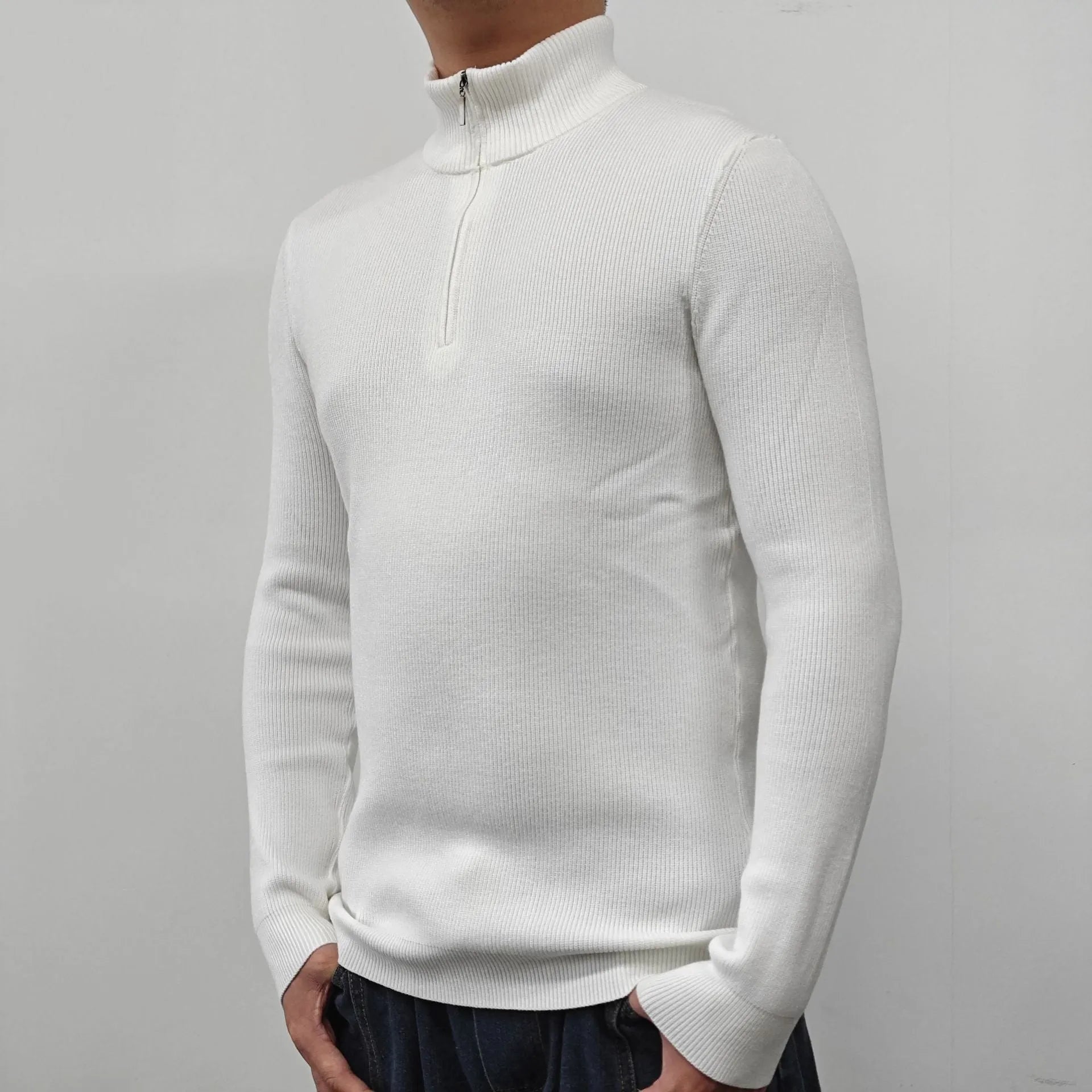 Men's black half-turtleneck zip-up pullover sweater with long sleeves on a model.