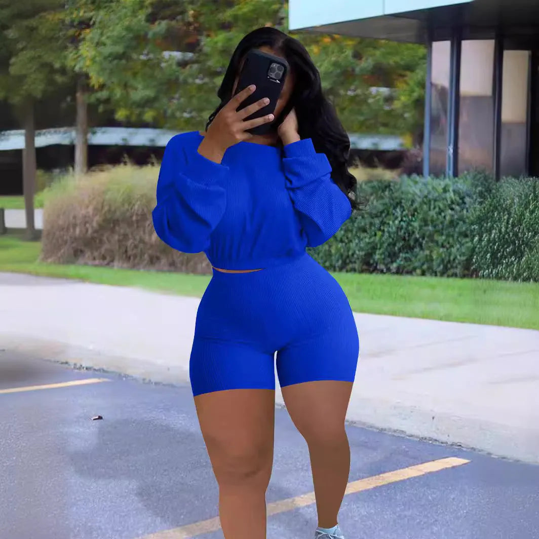 Women's off-shoulder stripe top with matching solid colour shorts in two-piece casual outfit set
