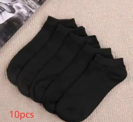 Black, white, and grey boat socks and medium tube socks from Degner in cotton blend fabric
