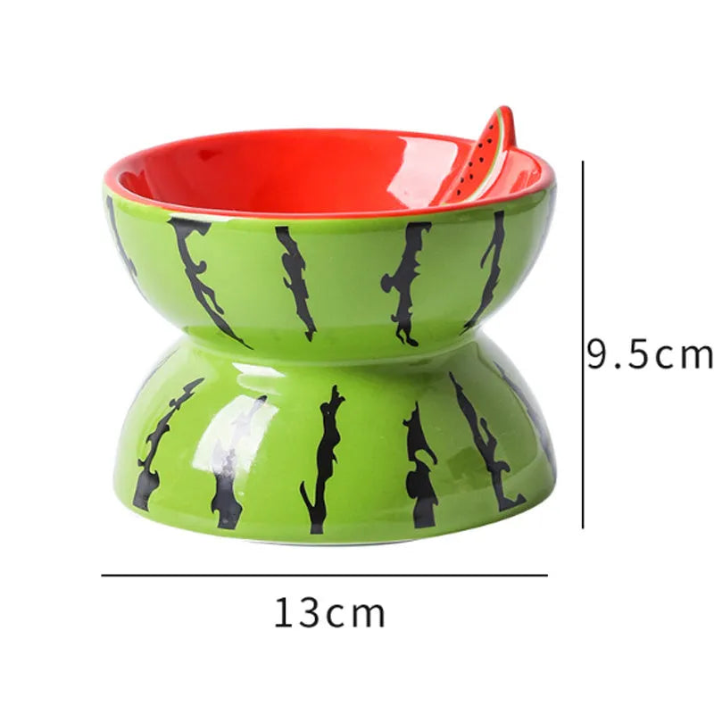 Ceramic elevated cat bowl with a tilted, widened dish and decorative pattern on a white background.