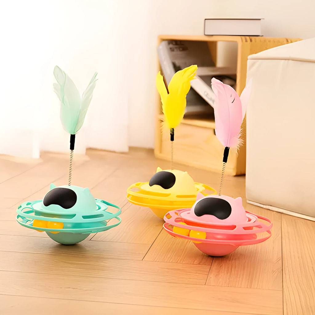 Pink cat tumbler turntable toy with rotating base and attached stick on white background