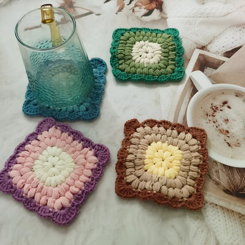 Crocheted wool grandmother lattice insulated cup placemat in four colours Emerald Sea Salt Blue Dream Purple Fog Brown