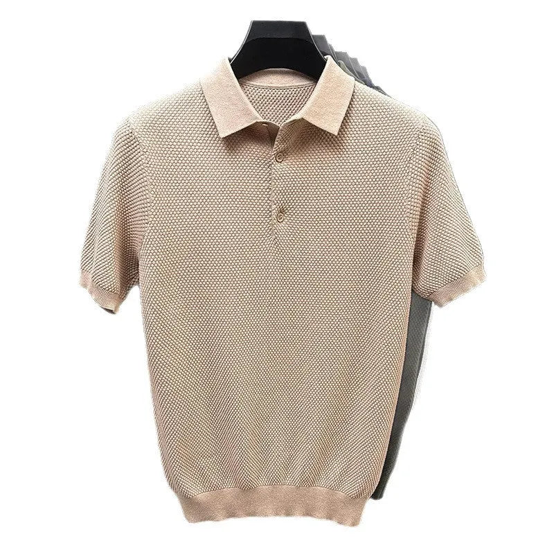 A loose short-sleeved cotton pullover sweater on a hanger, shown in a solid colour.