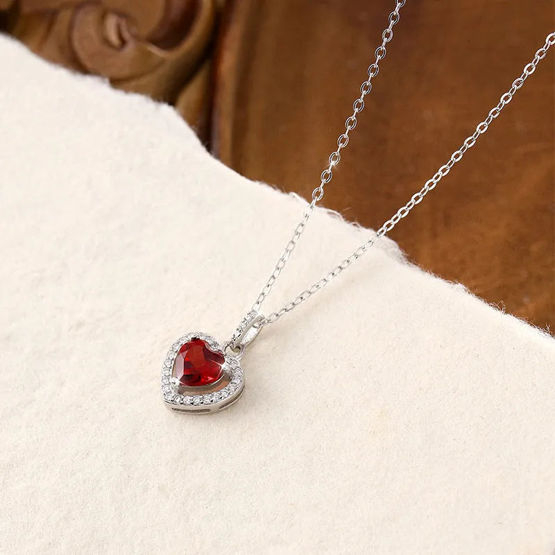 Heart shaped amethyst pendant on a 925 sterling silver cross chain necklace for women