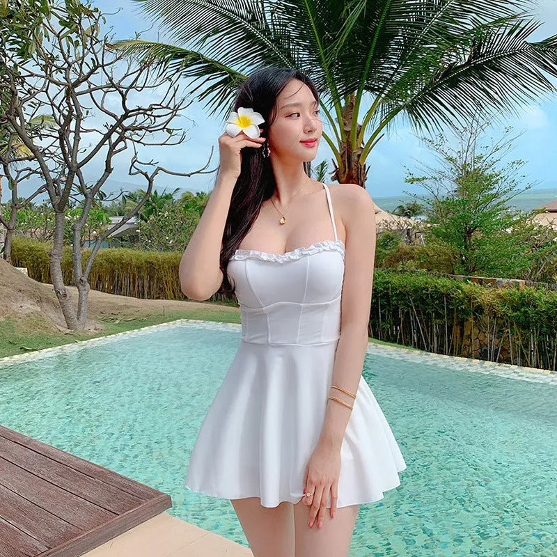 Women's hollow out one-piece skirt swimsuit in white nylon for swimming and wading