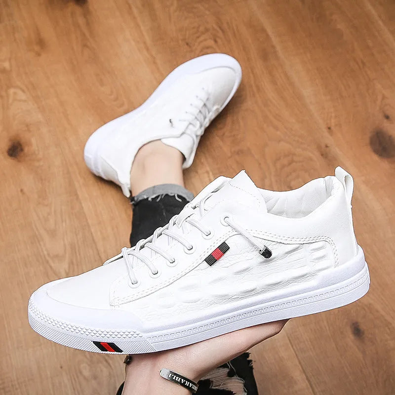 White men's casual sneakers with lace-up closure, rubber sole, and round toe cap on a plain background