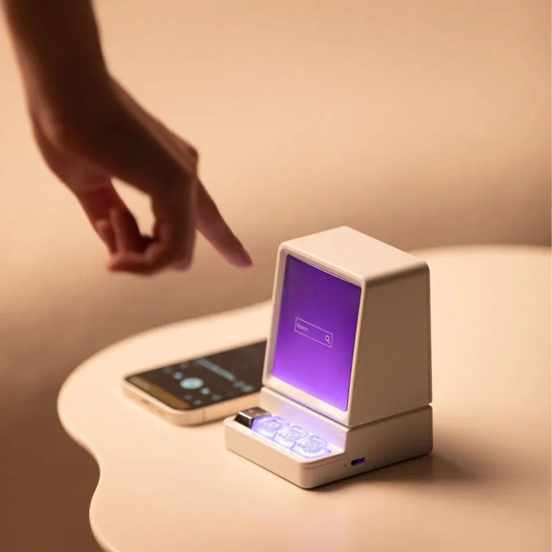 Portable classic computer-shaped Bluetooth speaker in light gray with lighting and voice prompt on a desktop