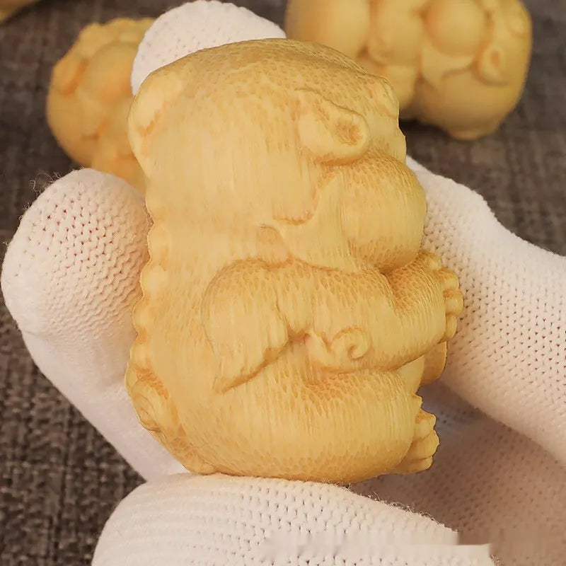 Solid bamboo carving ornament measuring 4.5cm tall by 3.5cm wide with traditional decorative carving