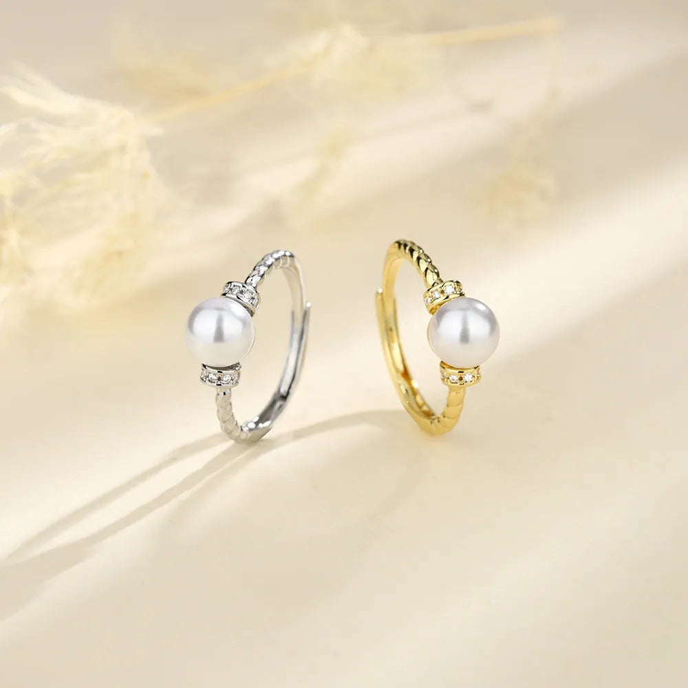 Adjustable copper pearl ring with antique twist geometric design in gold or silver colour
