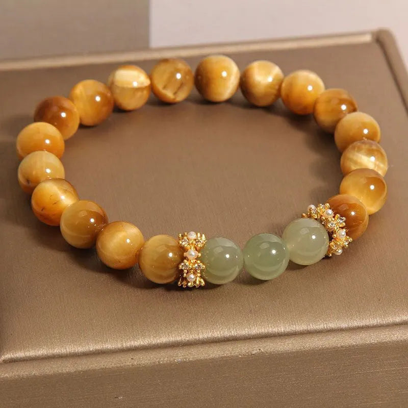 Natural tiger's eye and Hetian jade bracelet with diamond treatment showing golden gourd pattern