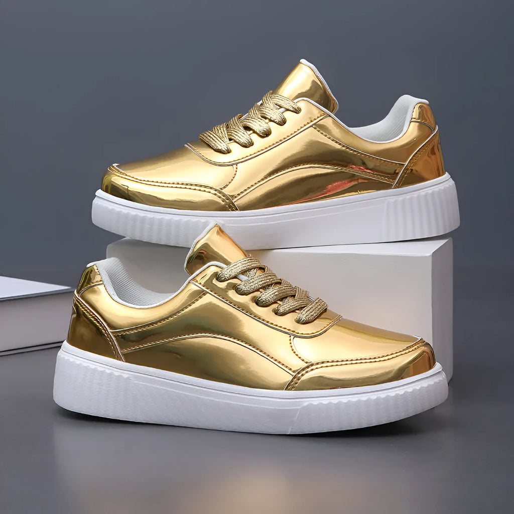Gold sequined platform sneakers with round toe and thick MD sole on a white background.