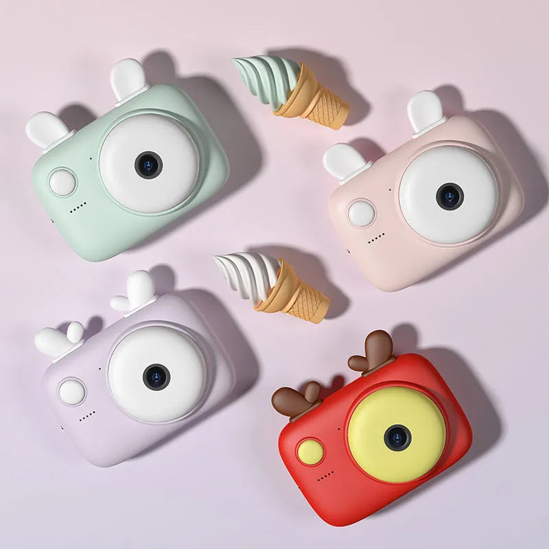 A2 kids digital camera in macaron colours with 2.4-inch screen and dual 40MP cameras on a lanyard.