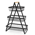 Detachable iron double-layer fruit basket with wooden handle on a kitchen table, black finish