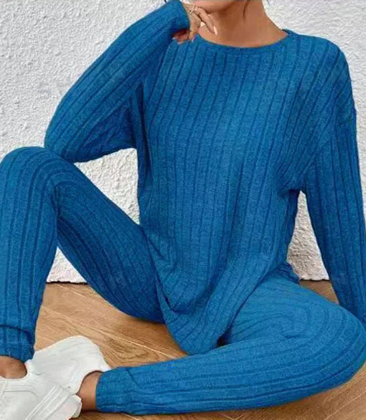 Women's black sunken stripe polyester two-piece loungewear set with regular sleeve top and matching trousers
