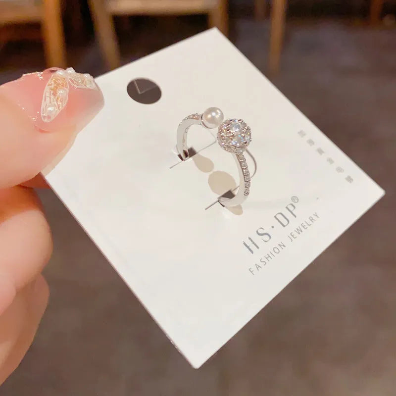 Women's gold plated open-end pearl ring with round zircon geometric design on copper base