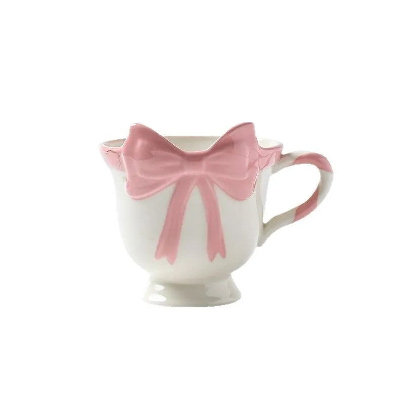 Ceramic mug with heart bow design in white powder or black pink colours, 301-400ml capacity