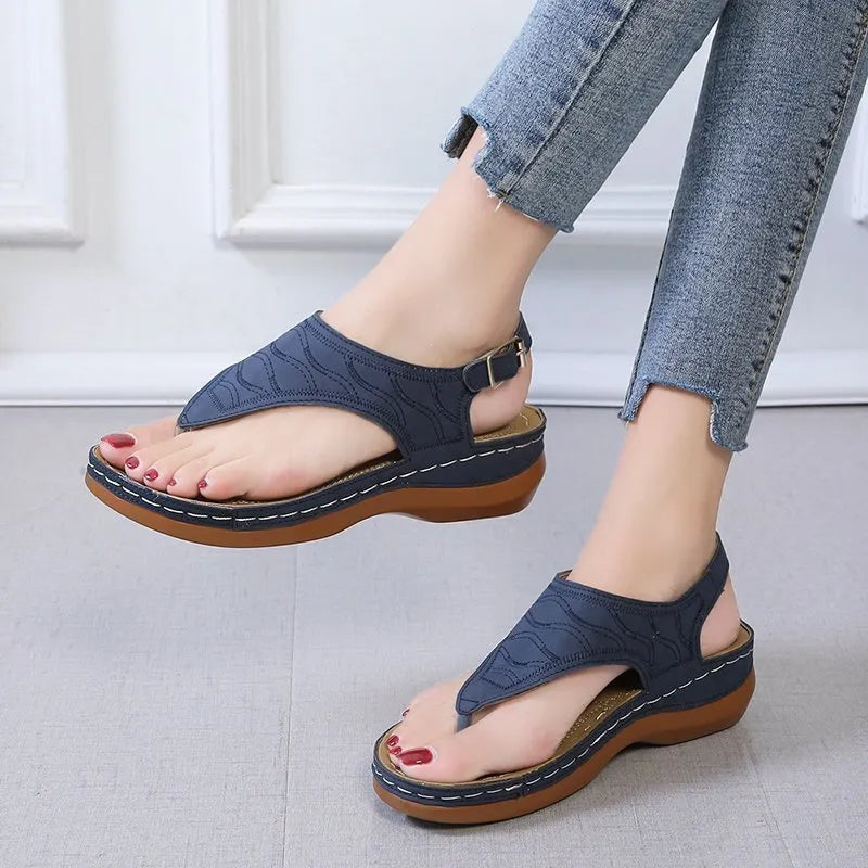 Women's casual wedge heel sandals in black with an adjustable back strap buckle.