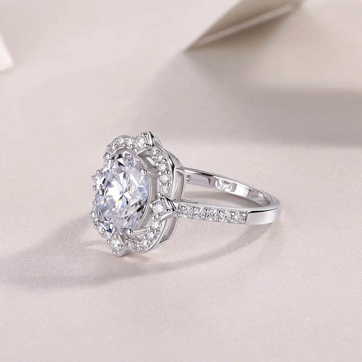 Camellia moissanite wedding ring with egg-shaped 8x10mm stone in S925 silver platinum-plated setting