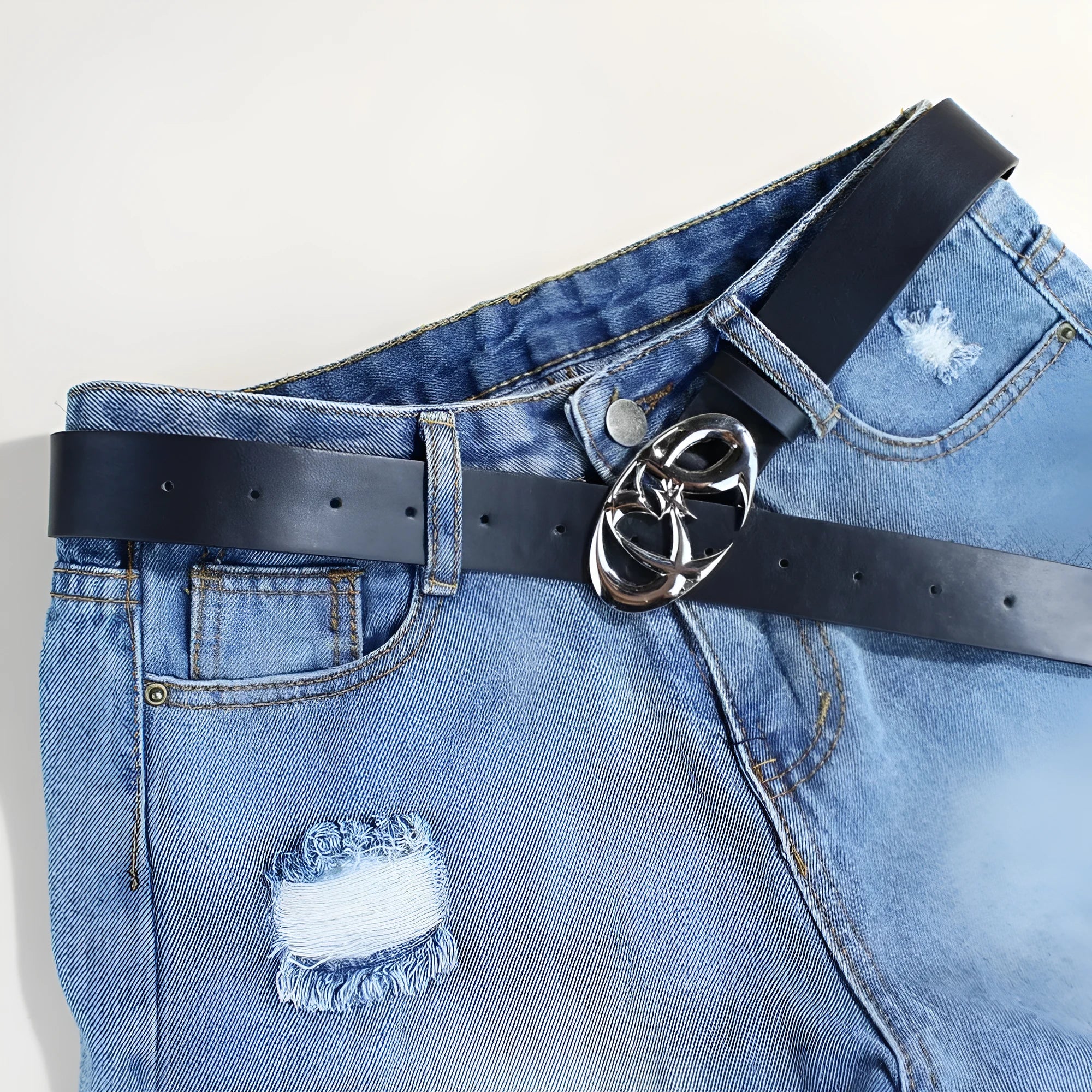Silver buckle casual belt with PU leather strap showing snap button fastening