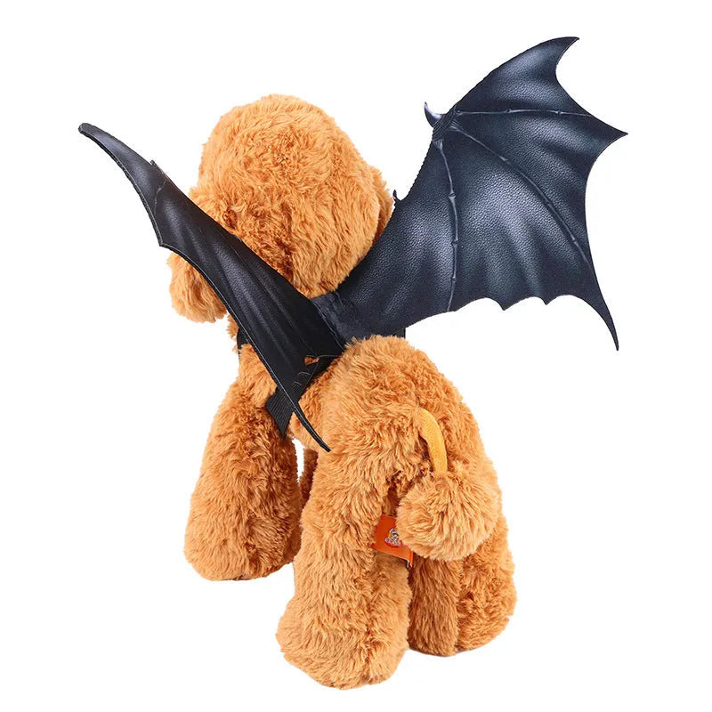 Black cloth bat wing costume for dogs and cats on a pet, showing three available sizes.