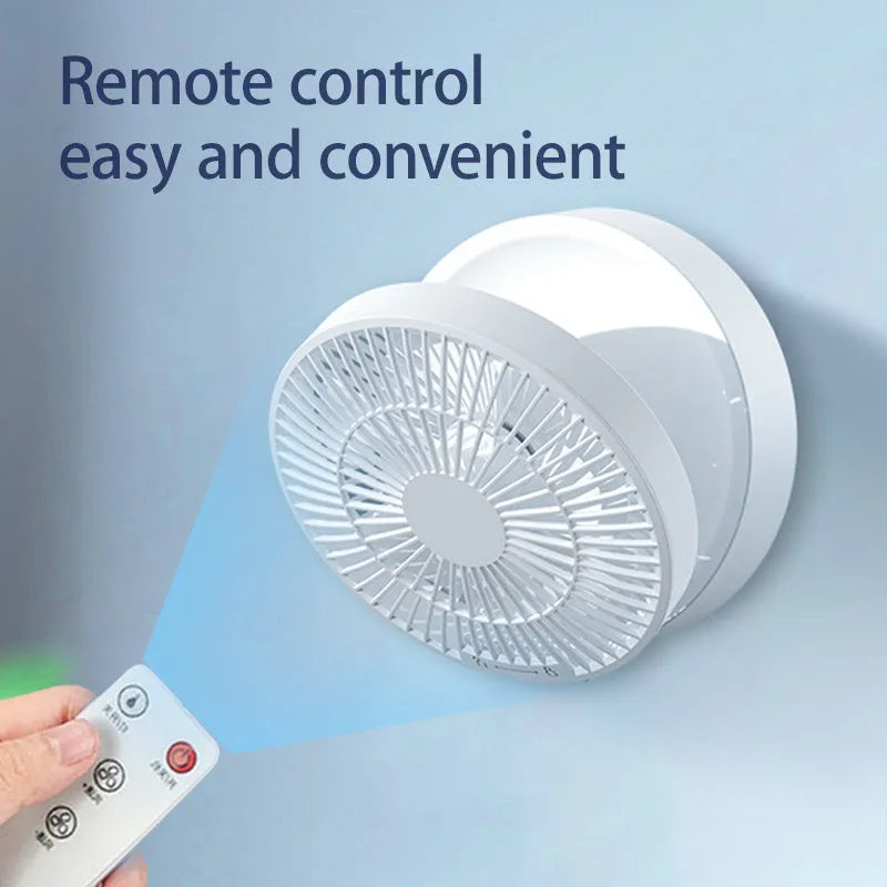 White portable folding fan with night light on a table, remote control beside it, showing its compact size.