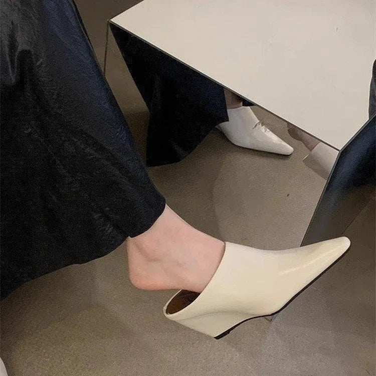 Wind wedge closed toe half slippers for women in PU upper, available in Black, Brown, and Off White