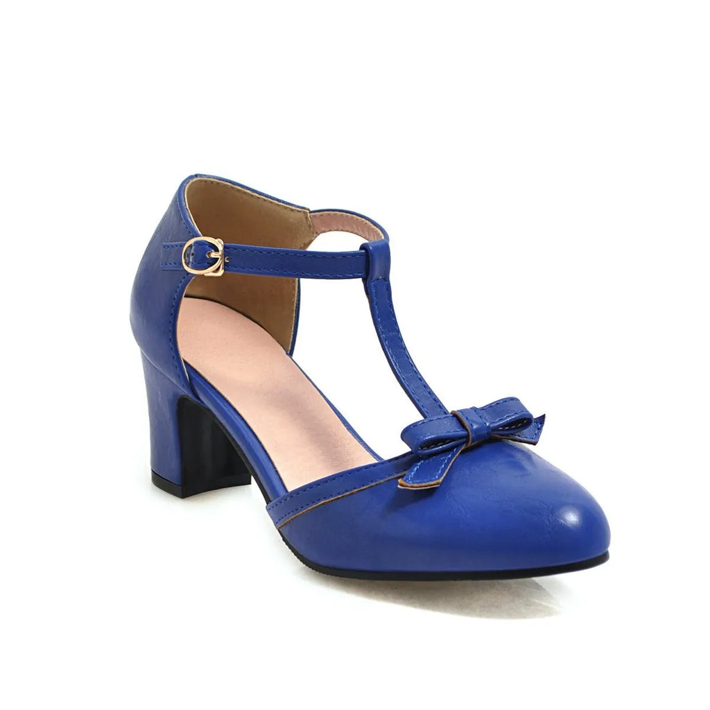 Yellow women's sandals with a chunky heel, buckle strap, and round toe.