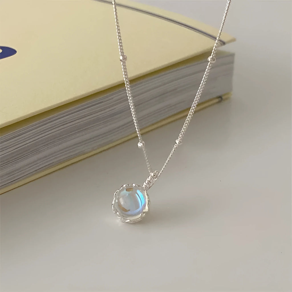 Silver geometric pendant on a curb chain necklace, adjustable from 41cm to 50cm length.
