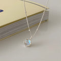 Silver geometric pendant on a curb chain necklace, adjustable from 41cm to 50cm length.
