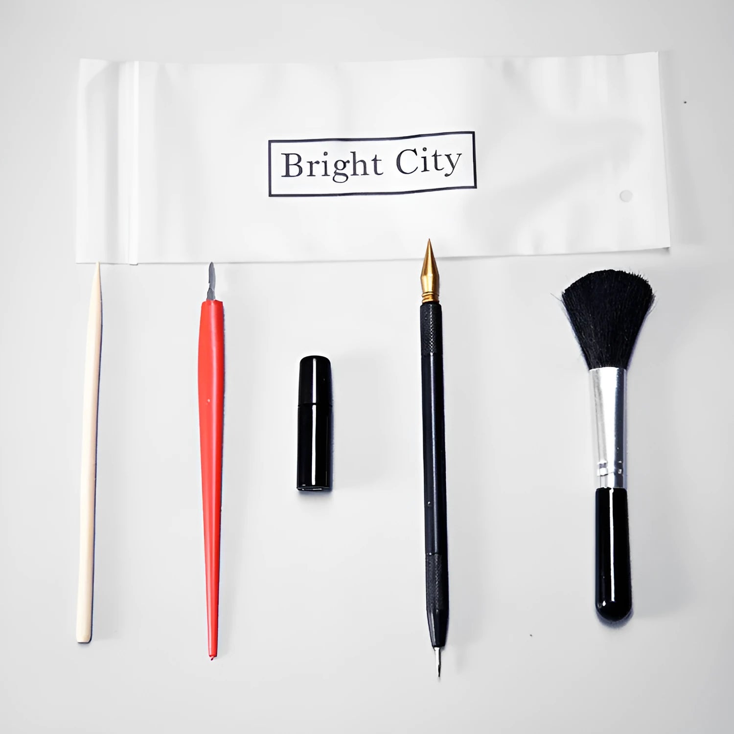 Creative scraping painting tool set with brushes, pens, scrapers, and photo frames for scratch art projects
