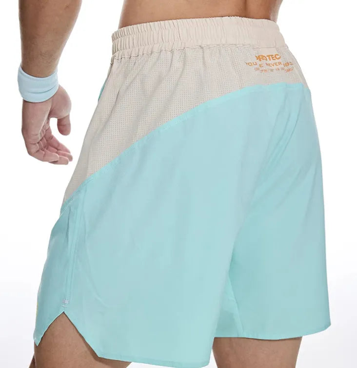 Men's grey workout shorts with elastic waistband and lace-up fly for gym training sessions