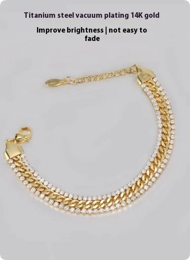 Gold tennis bracelet with titanium steel construction and artificial gemstone details