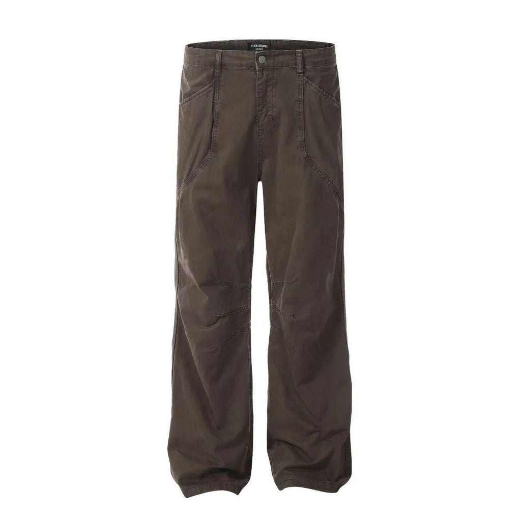 Men's brown straight-leg cotton trousers showing high-waist design with wide leg opening and zipper fly