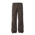 Men's brown straight-leg cotton trousers showing high-waist design with wide leg opening and zipper fly