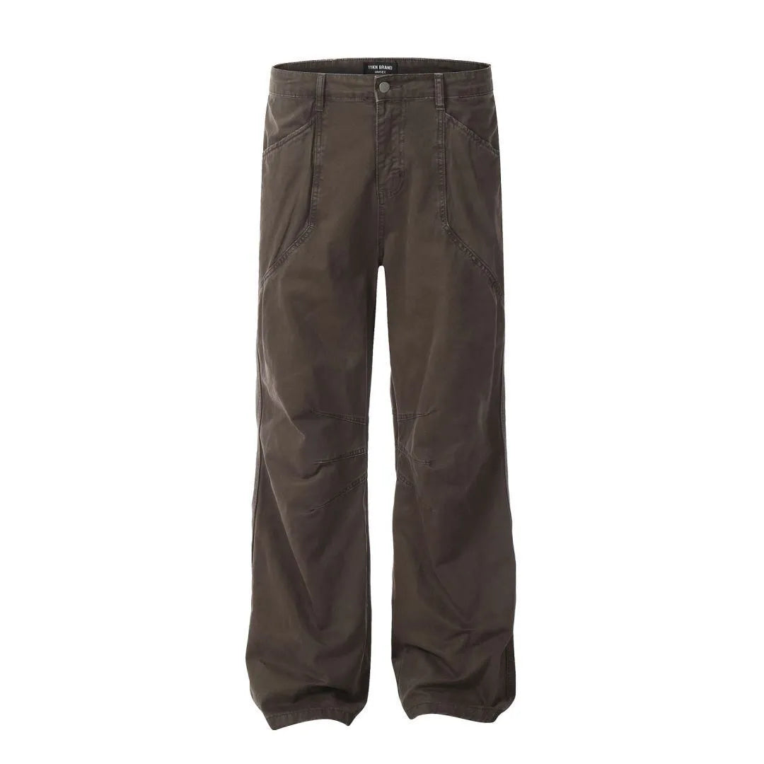 Men's brown straight-leg cotton trousers showing high-waist design with wide leg opening and zipper fly