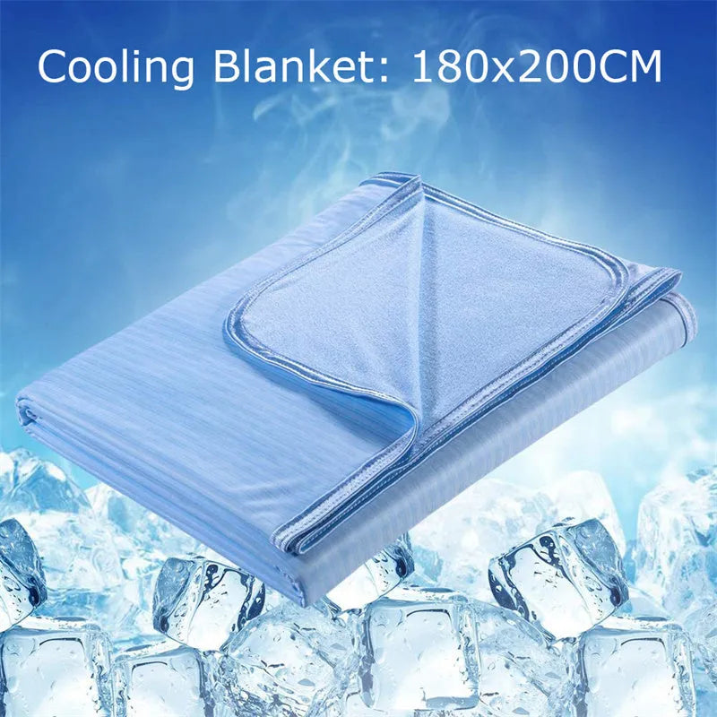 Blue cooling blanket with Q-Max 0.4 cooling fibers, polyester fabric, folded on a bed