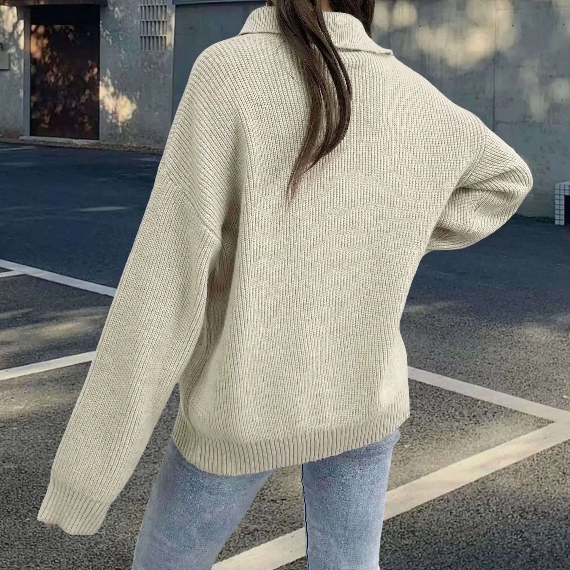 Women's grey alpaca wool pullover sweater with oblique diagonal zip and retro turtleneck collar.