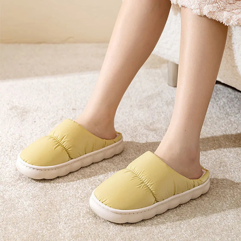 Blue winter house slippers with artificial leather upper, thick rubber sole, and plush lining.
