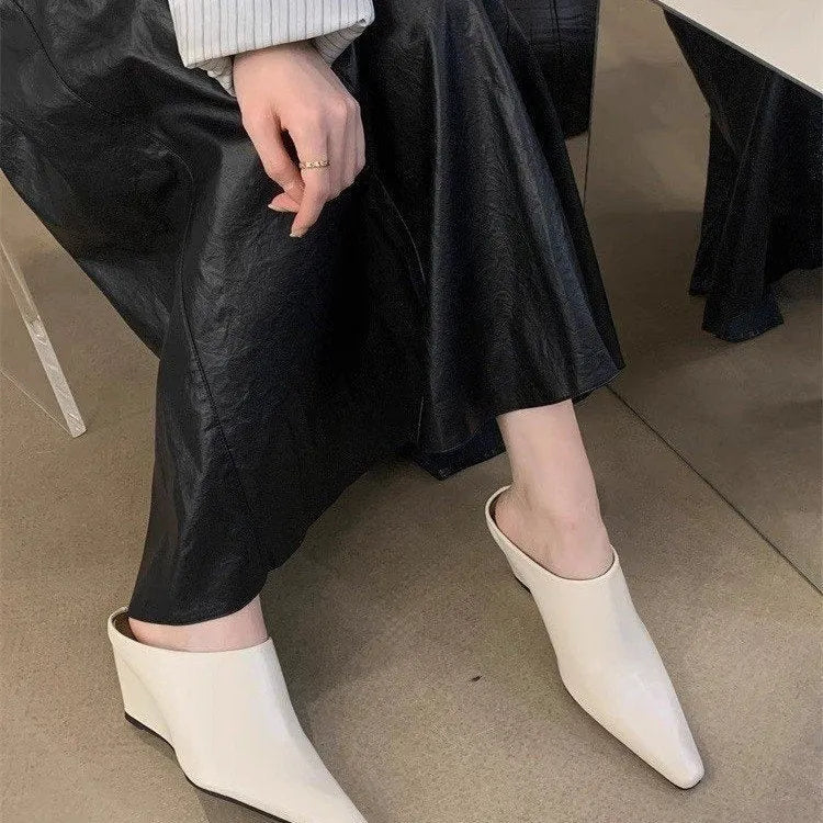 Wind wedge closed toe half slippers for women in PU upper, available in Black, Brown, and Off White