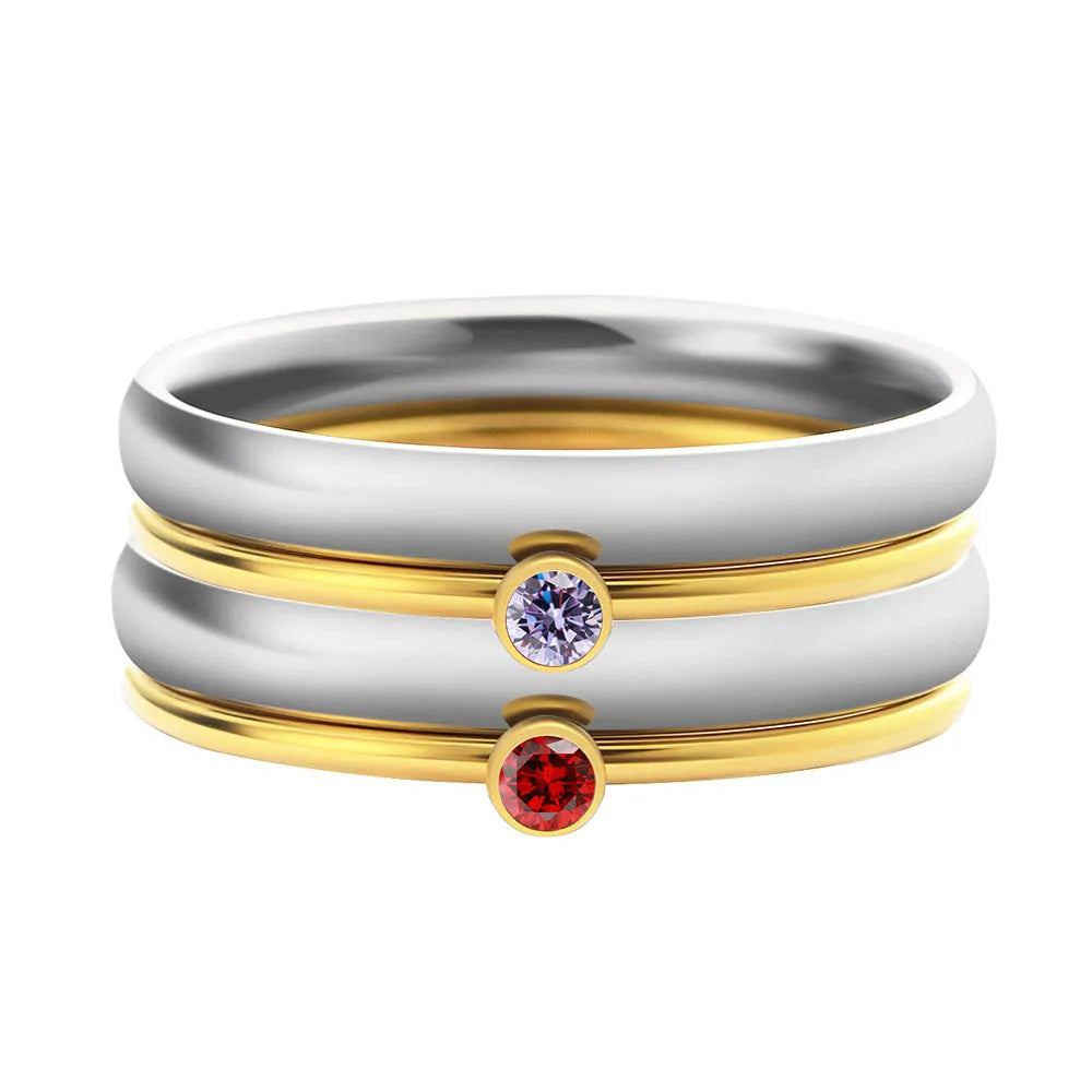 Geometric titanium steel ring with engraved December birthstone colour design on a white background.
