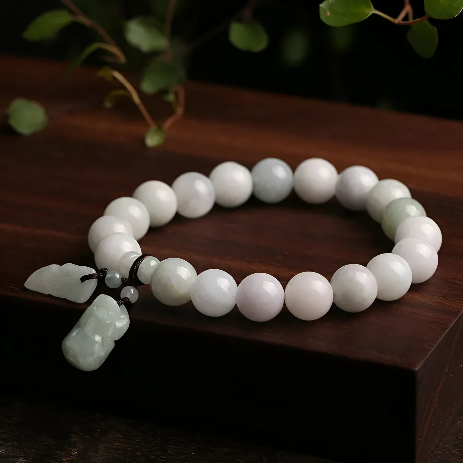 Natural jade bracelet with geometric beads showing Maitreya Buddha, double apple, and money bag symbols