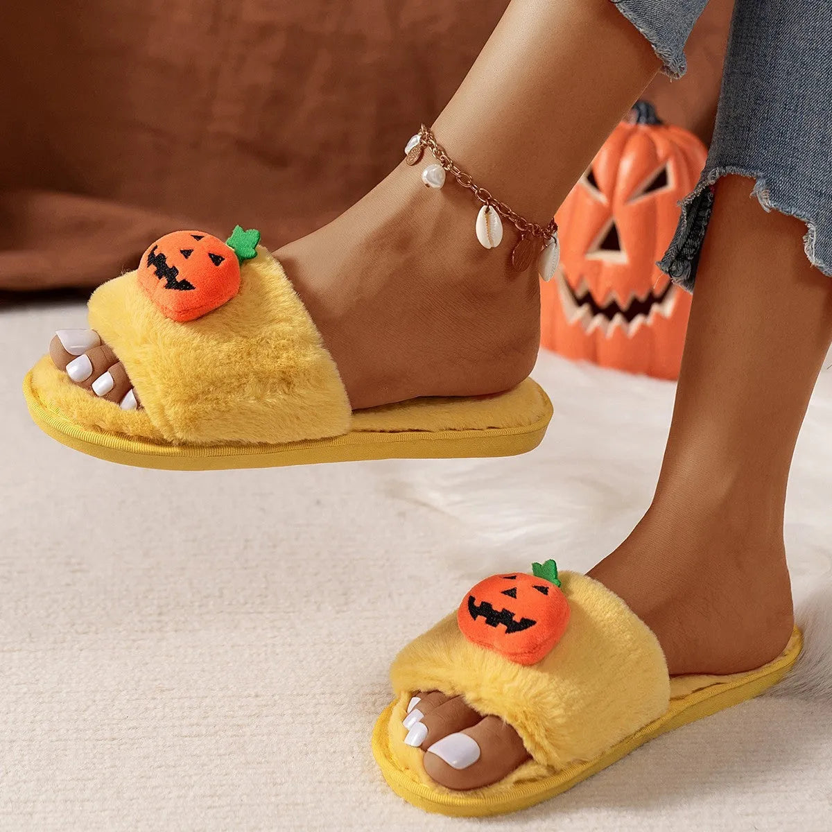 White and yellow Halloween pumpkin cartoon plush slippers with open toe and PVC sole.