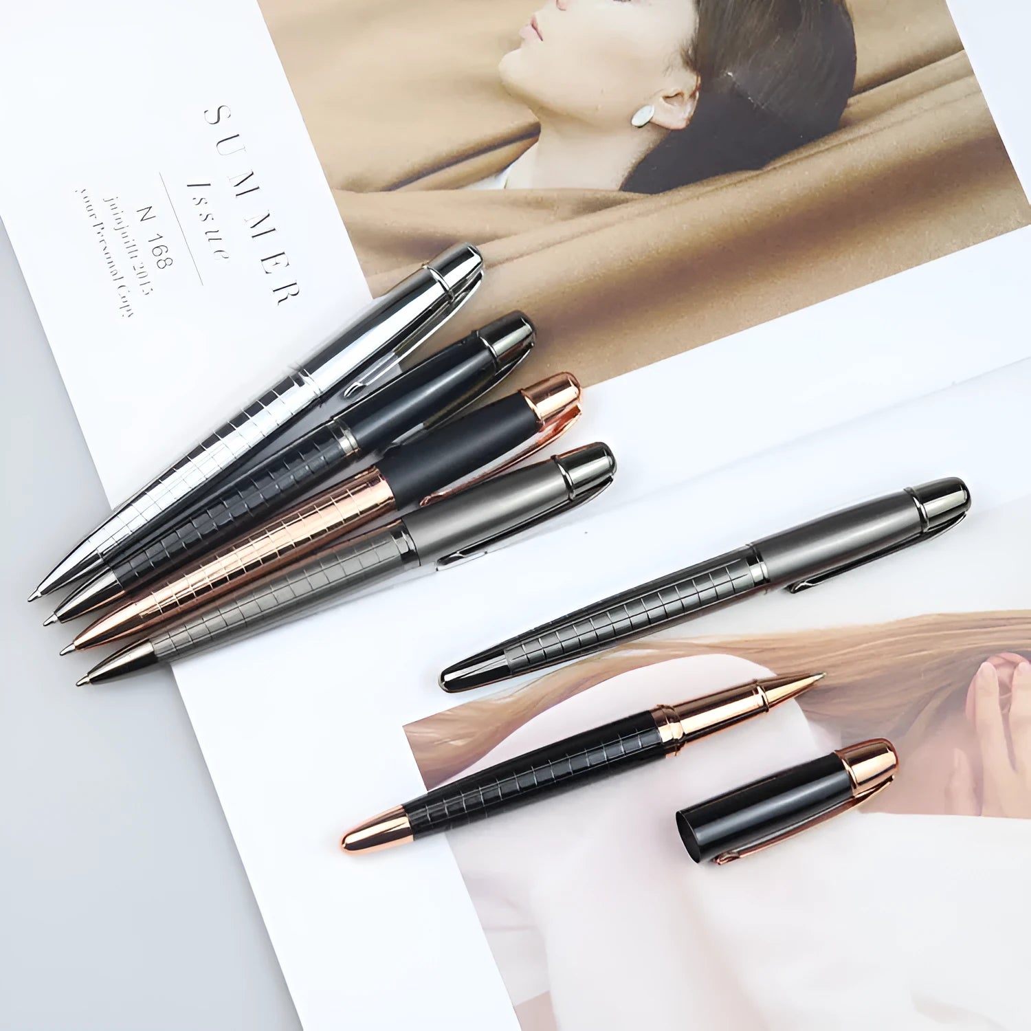 Gun gray metal roller pen with black ink cap, 13.5cm length, on white background